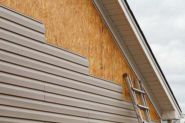 Professional Storm Damage Siding Repair technician working in Franklinton, NC